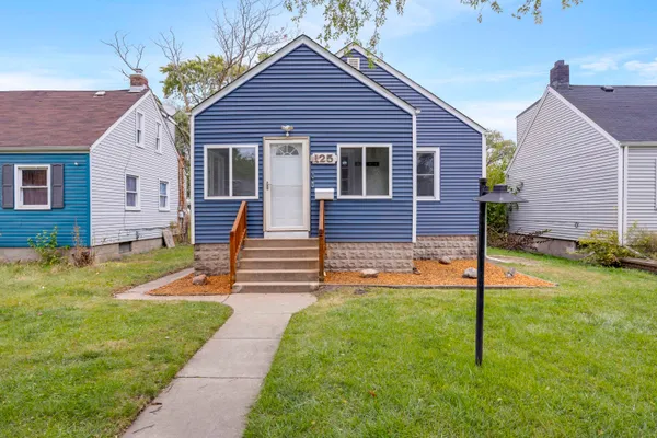 a front view of a house with yard