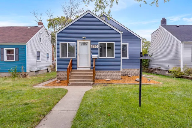 a front view of a house with yard