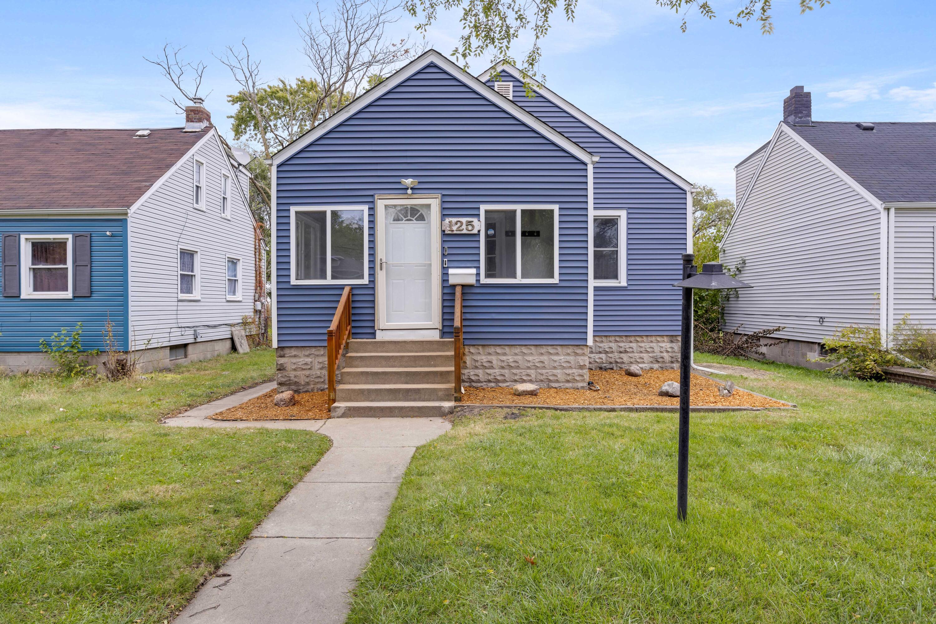 125 Marshall Street Gary, IN 46404 - Photo 1 of 23 a front view of a house with yard