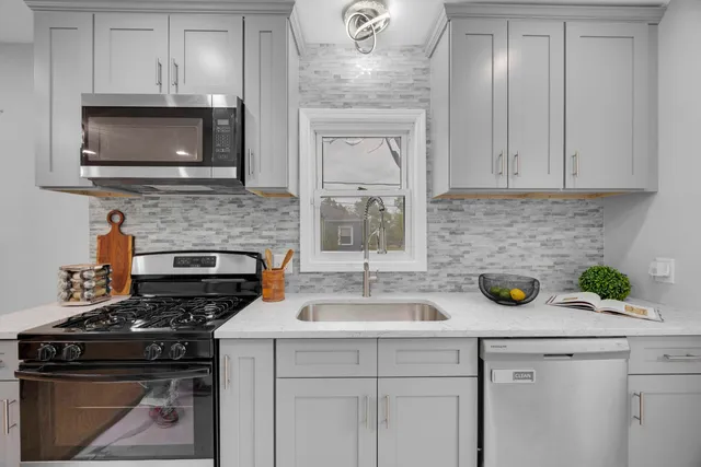 a kitchen with a stove and a microwave