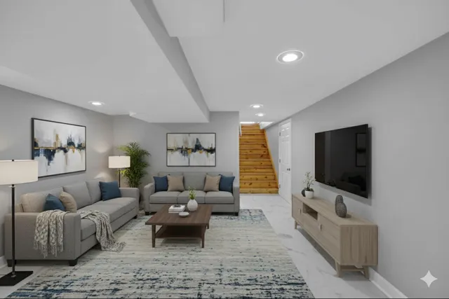 a living room with furniture and a flat screen tv