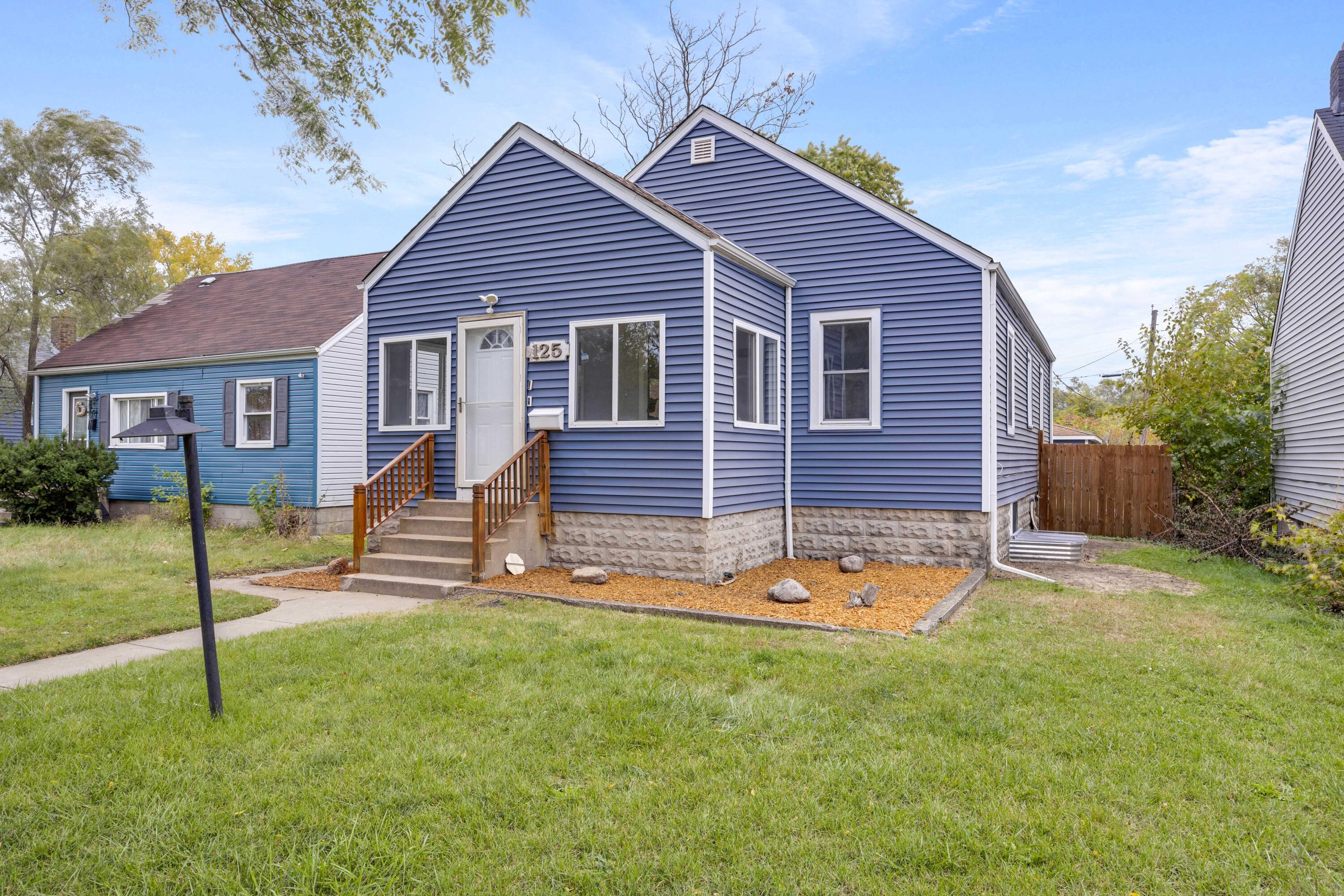 125 Marshall Street Gary, IN 46404 - Photo 23 of 23 a front view of a house with a yard