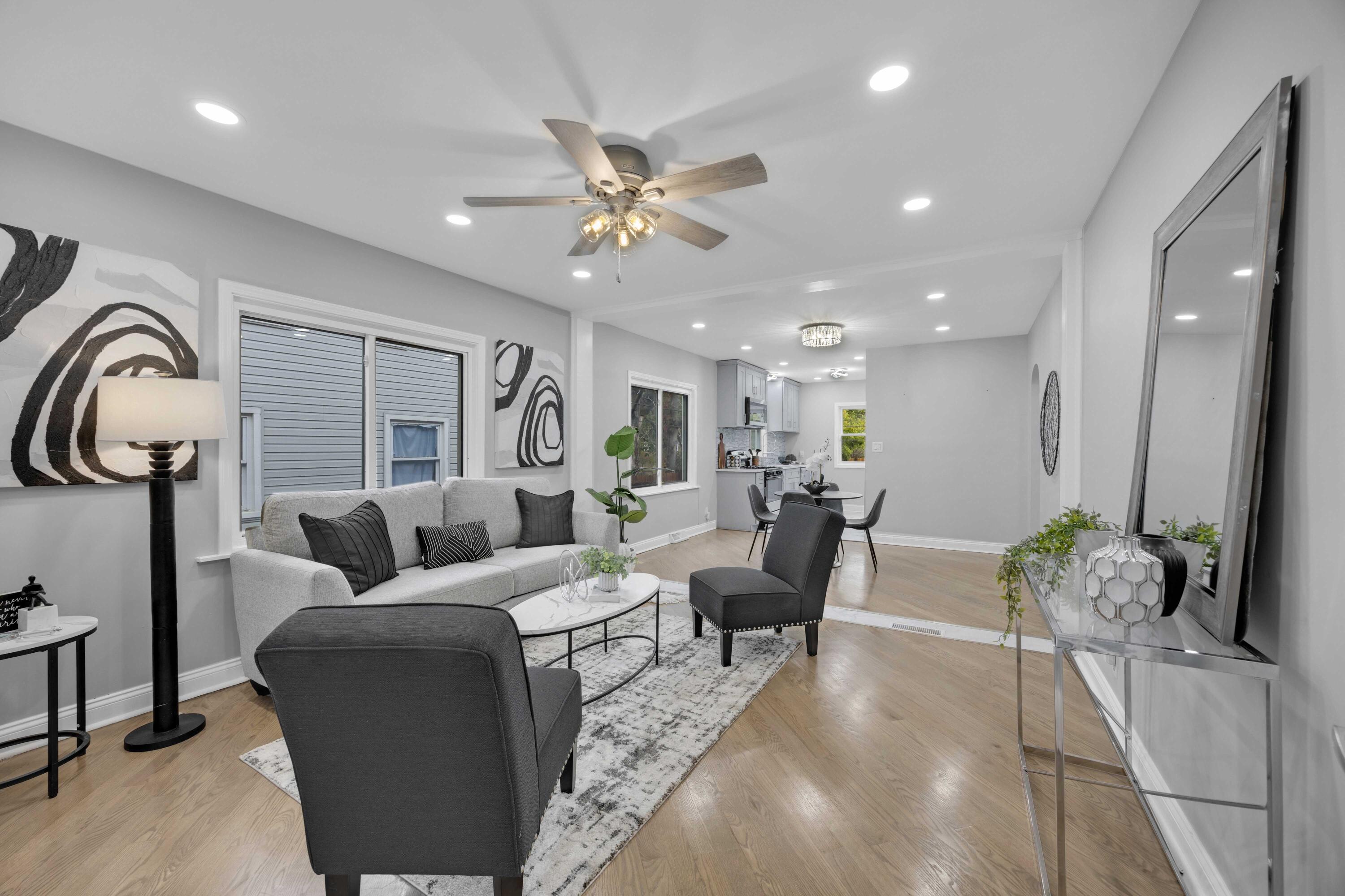 125 Marshall Street Gary, IN 46404 - Photo 5 of 23 a living room with furniture and a chandelier
