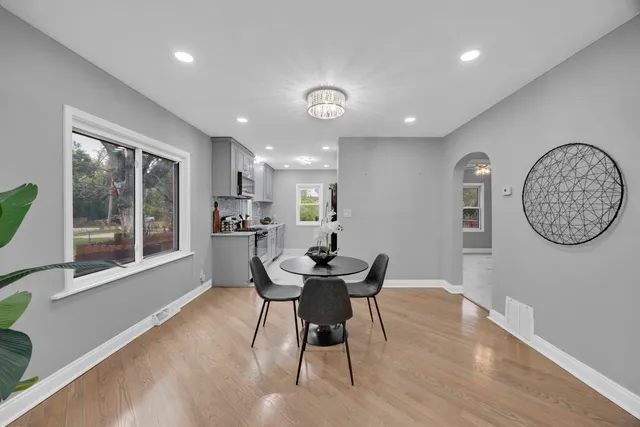 a view of a dining room with furniture window and wooden floor