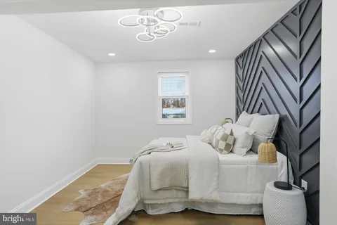 a bedroom with bed and window