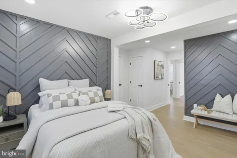 a bedroom with a large bed and a window