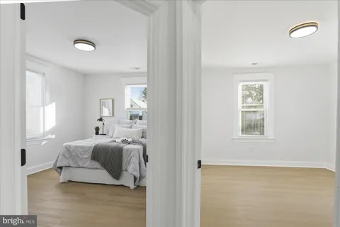 a bedroom with a bed and a table
