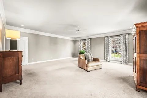 a living room with furniture and a bathtub
