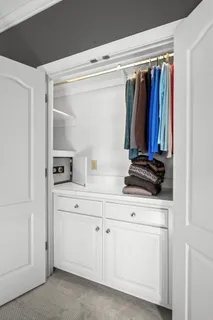 a bathroom with a bathtub a window and a shower