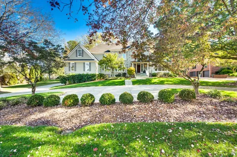 a view of a house with a street