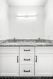 a view of a couches in the patio with a yard