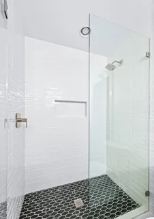 a view of a patio with table and chairs potted plants and large tree