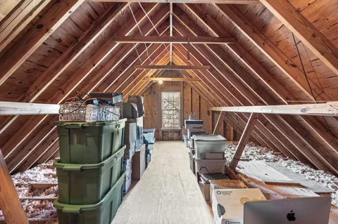 a front view of a house with swimming pool having outdoor seating