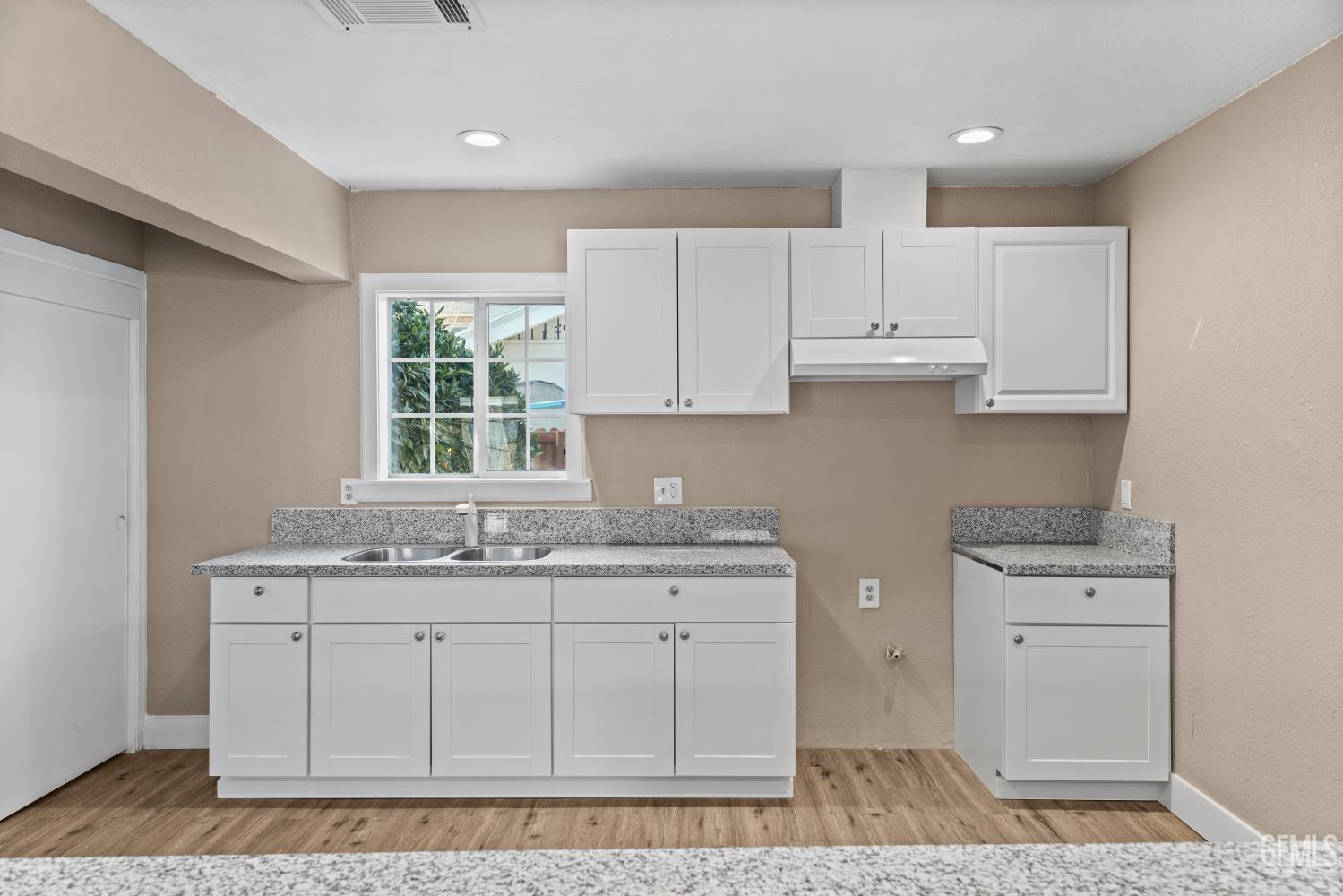 Undisclosed Address Bakersfield, CA 93305 - Photo 13 of 32 a kitchen with stainless steel appliances granite countertop a sink stove and cabinets