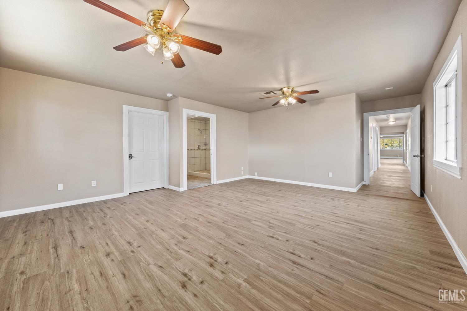 Undisclosed Address Bakersfield, CA 93305 - Photo 18 of 32 a view of a livingroom with a ceiling fan