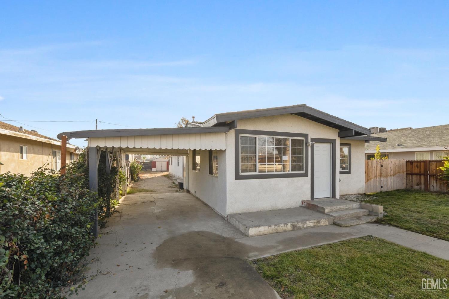 Undisclosed Address Bakersfield, CA 93305 - Photo 2 of 32 a view of a house with a backyard