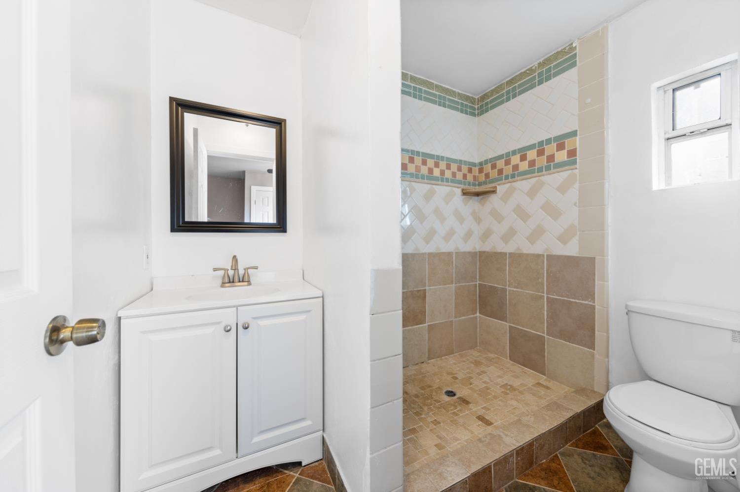 Undisclosed Address Bakersfield, CA 93305 - Photo 24 of 32 a bathroom with a sink a toilet and shower