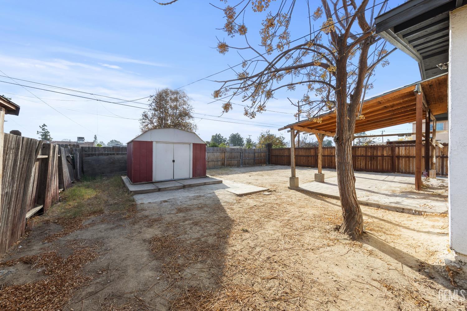 Undisclosed Address Bakersfield, CA 93305 - Photo 31 of 32 a view of a yard with a tree