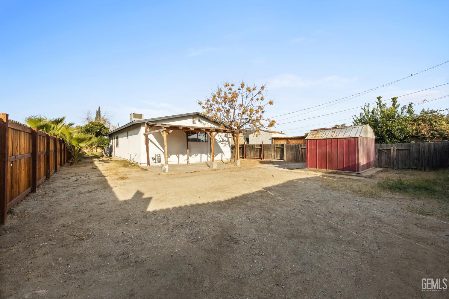 Undisclosed Address Bakersfield, CA 93305 - Photo 32 of 32 a view of a house with a yard