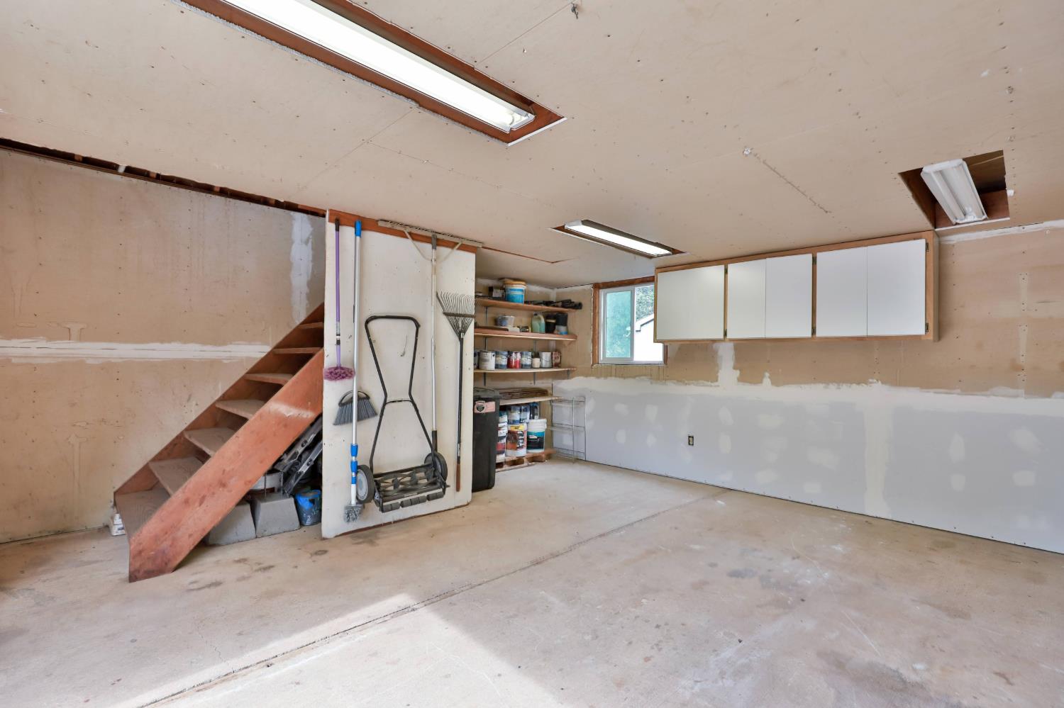 4773 Jacarah Road Placerville, CA 95667 - Photo 81 of 94 The downstairs room of the barn has tons of storage.