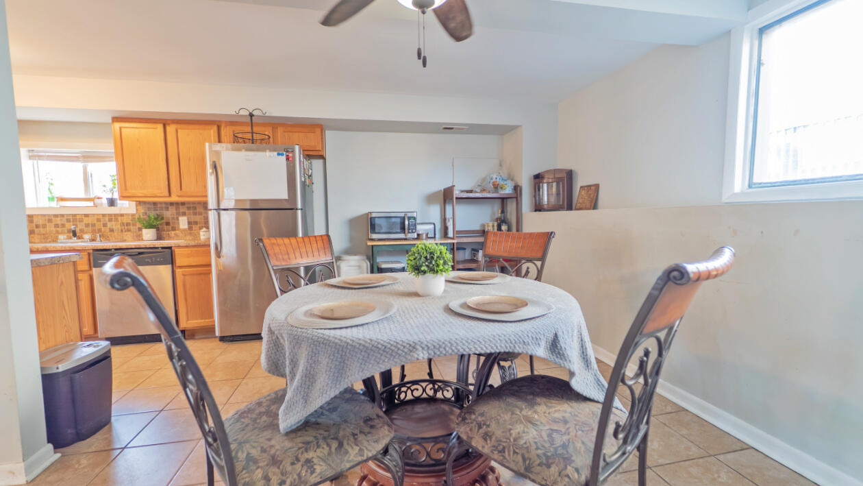 6318 Garfield Street Merrillville, IN 46410 - Photo 11 of 27 a view of a dining room with furniture window and outside view