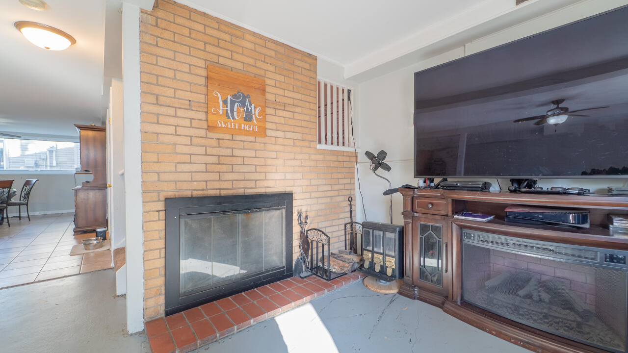 6318 Garfield Street Merrillville, IN 46410 - Photo 15 of 27 a living room with furniture and a fireplace