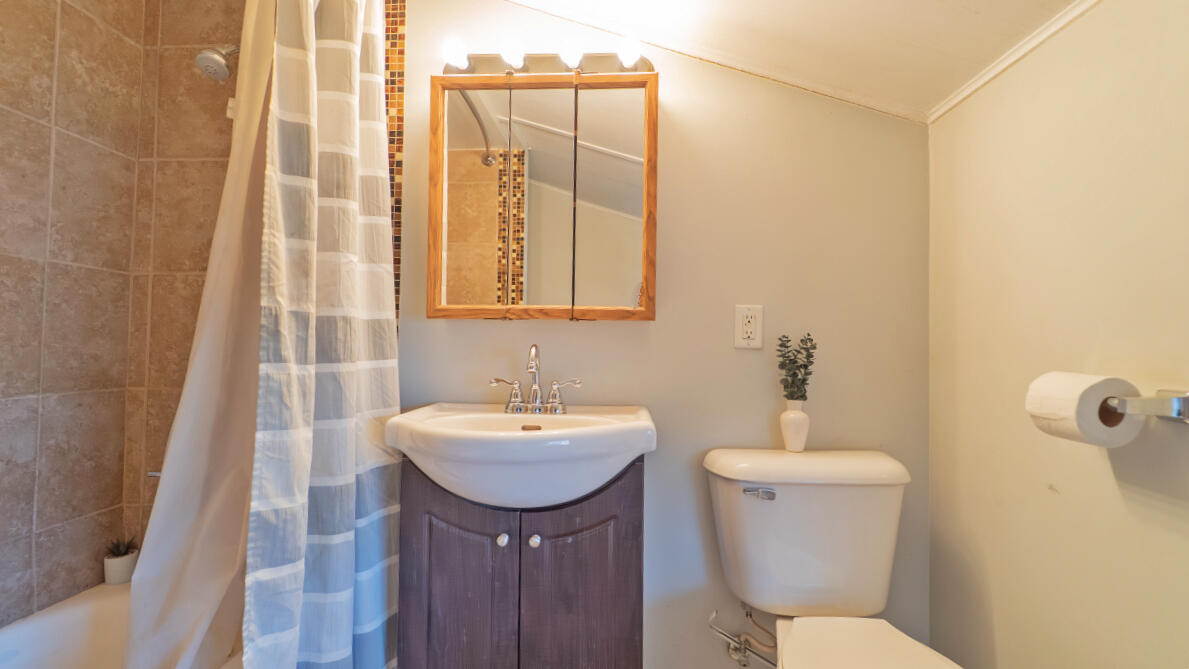 6318 Garfield Street Merrillville, IN 46410 - Photo 18 of 27 a bathroom with a toilet sink and mirror