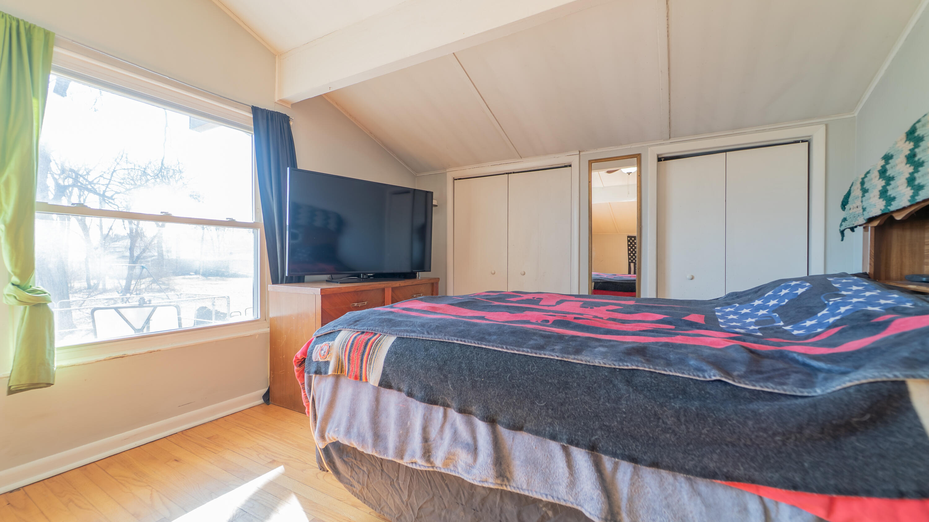 6318 Garfield Street Merrillville, IN 46410 - Photo 19 of 27 a bedroom with a large bed and a large window