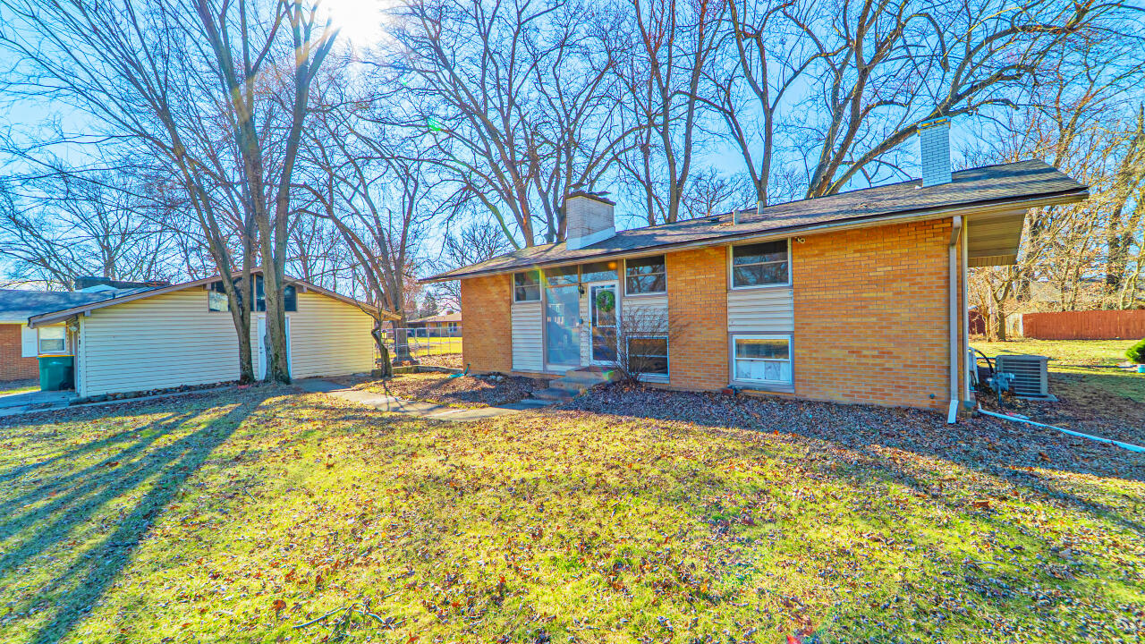 6318 Garfield Street Merrillville, IN 46410 - Photo 2 of 27 a view of a house with backyard and sitting area
