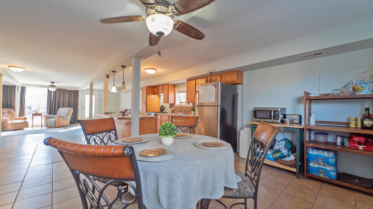 6318 Garfield Street Merrillville, IN 46410 - Photo 9 of 27 a dining room with furniture and a kitchen view