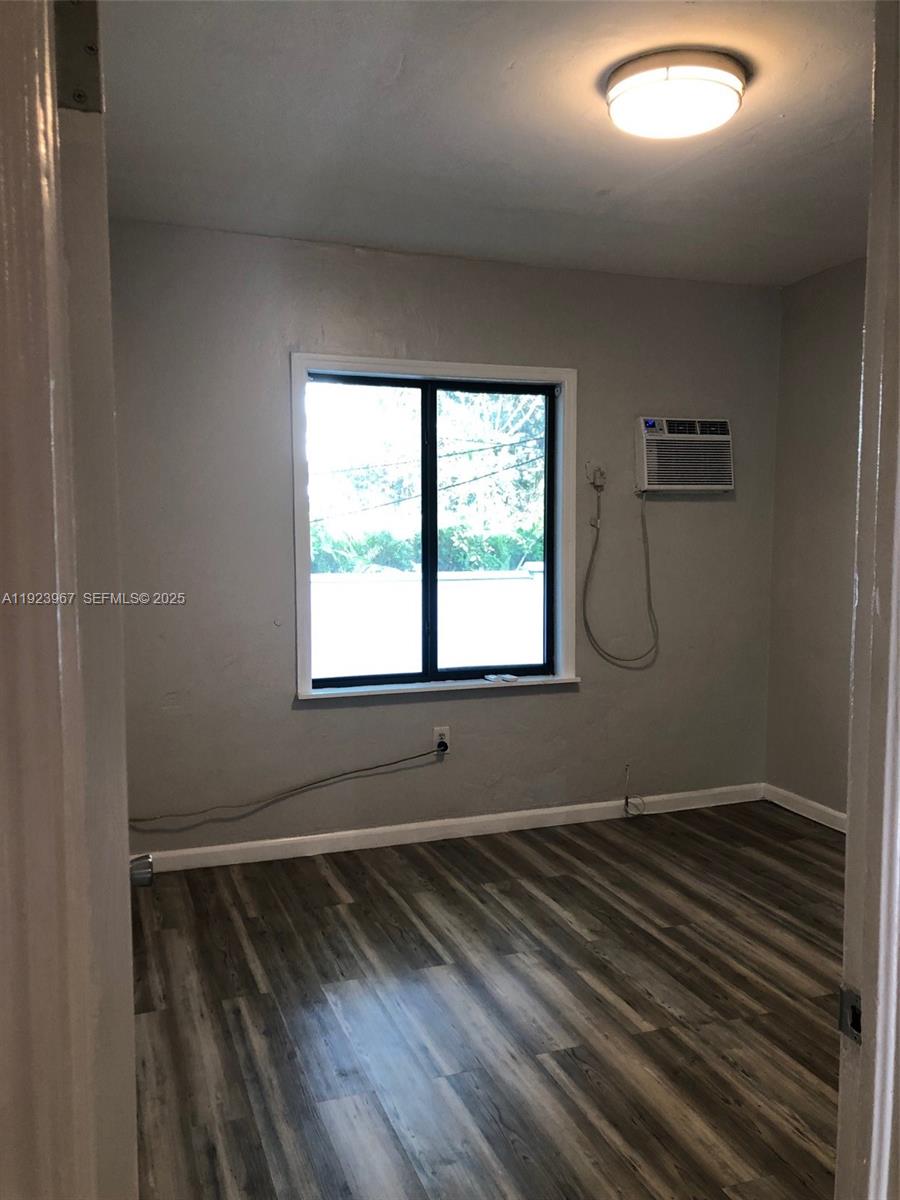 570 Northeast 69th Street, Unit 2 Miami, FL 33138 - Photo 13 of 21 a room with a window