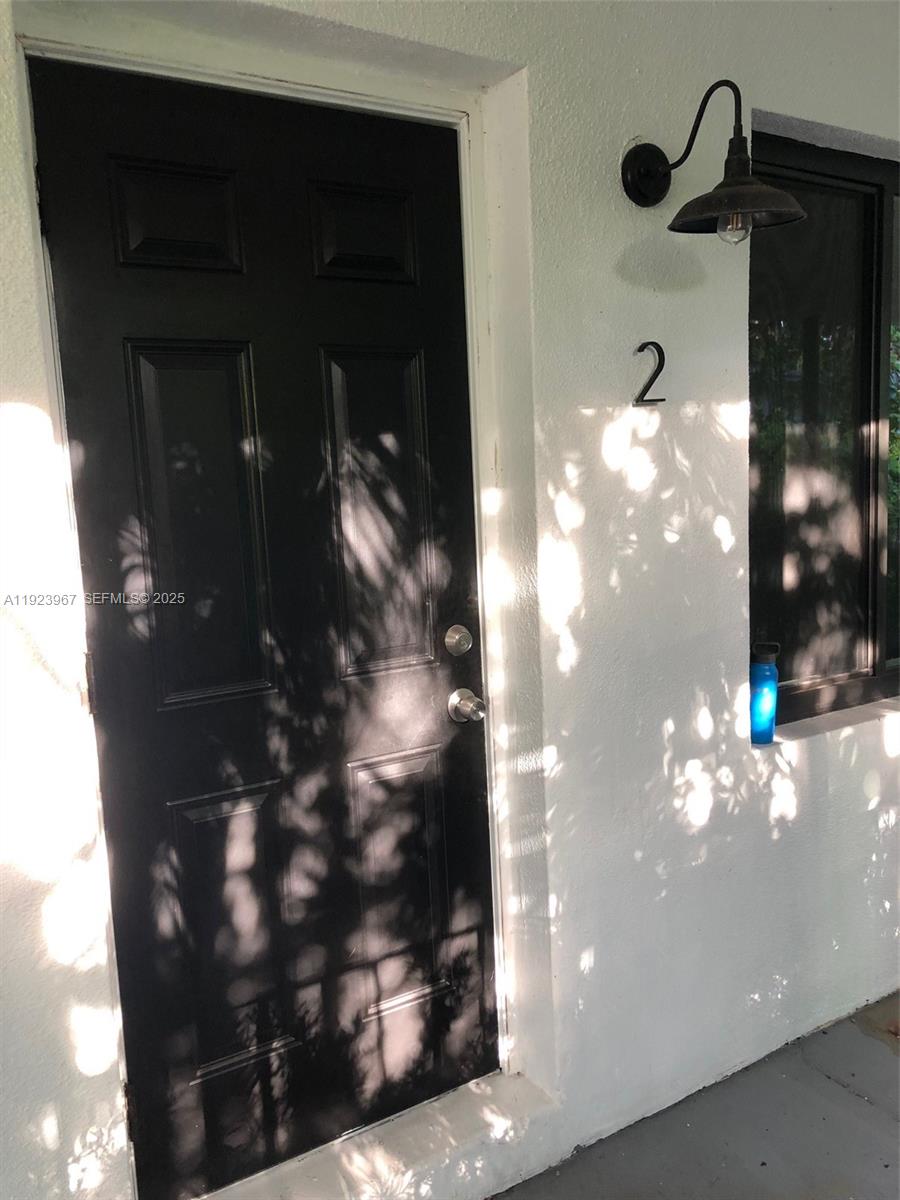 570 Northeast 69th Street, Unit 2 Miami, FL 33138 - Photo 5 of 21 a view of a glass door