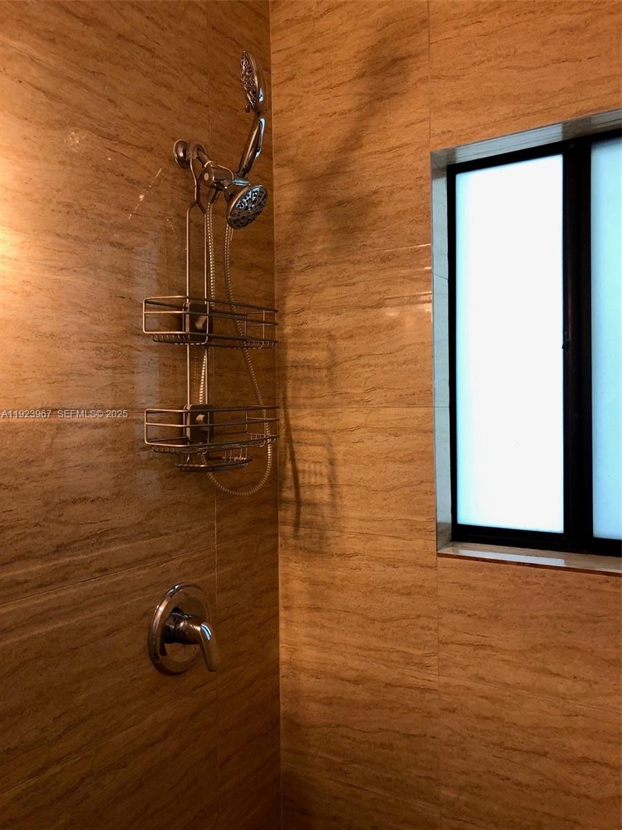 570 Northeast 69th Street, Unit 2 Miami, FL 33138 - Photo 9 of 21 a bathroom with a shower