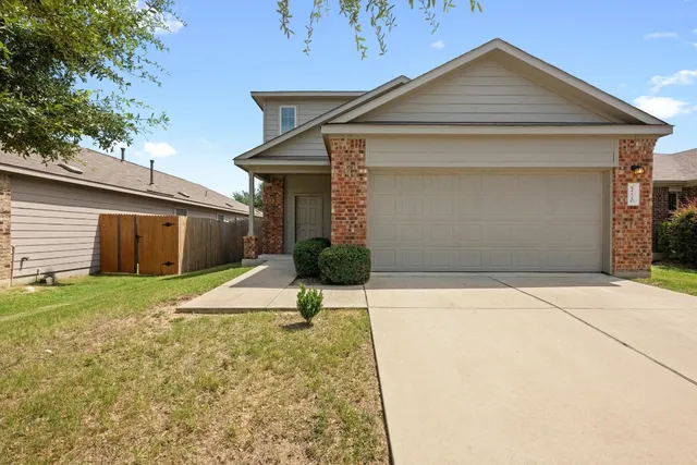 a house with yard in front of it