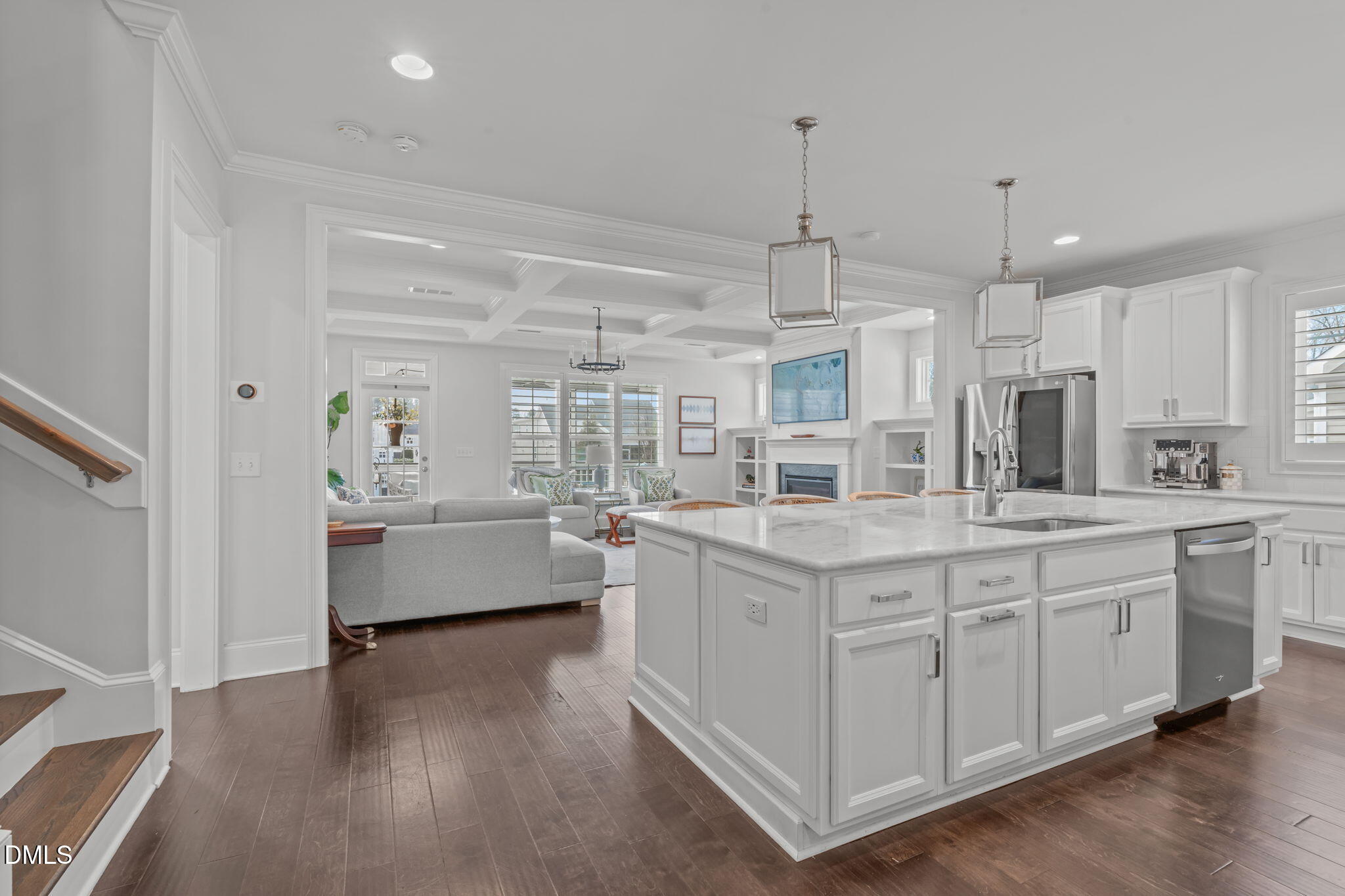 4144 Olde Judd Drive Willow Spring, NC 27592 - Photo 51 of 52 a large white kitchen with kitchen island a large counter space a sink stainless steel appliances and cabinets