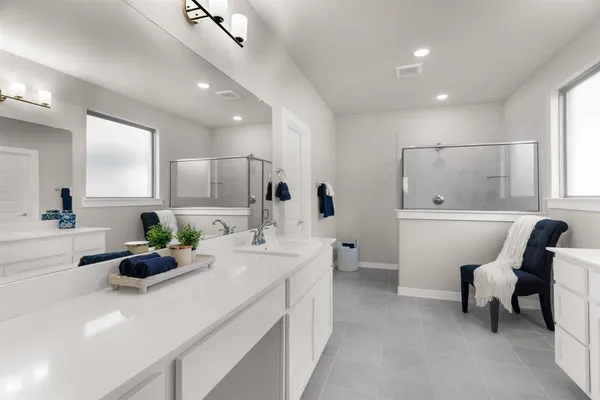 a bathroom with a sink double vanity and a mirror