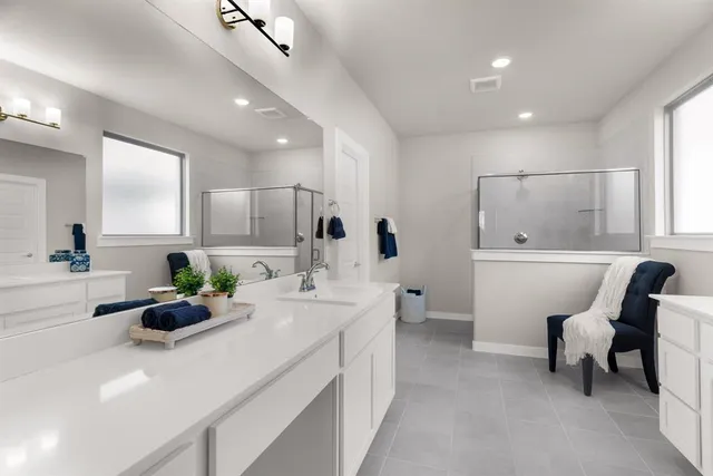a bathroom with a sink double vanity and a mirror