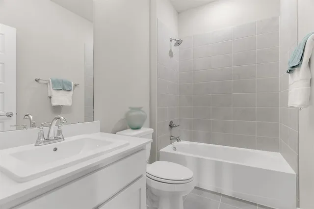 a bathroom with a sink toilet and bathtub