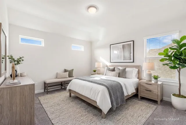 a bedroom with a bed and a couch