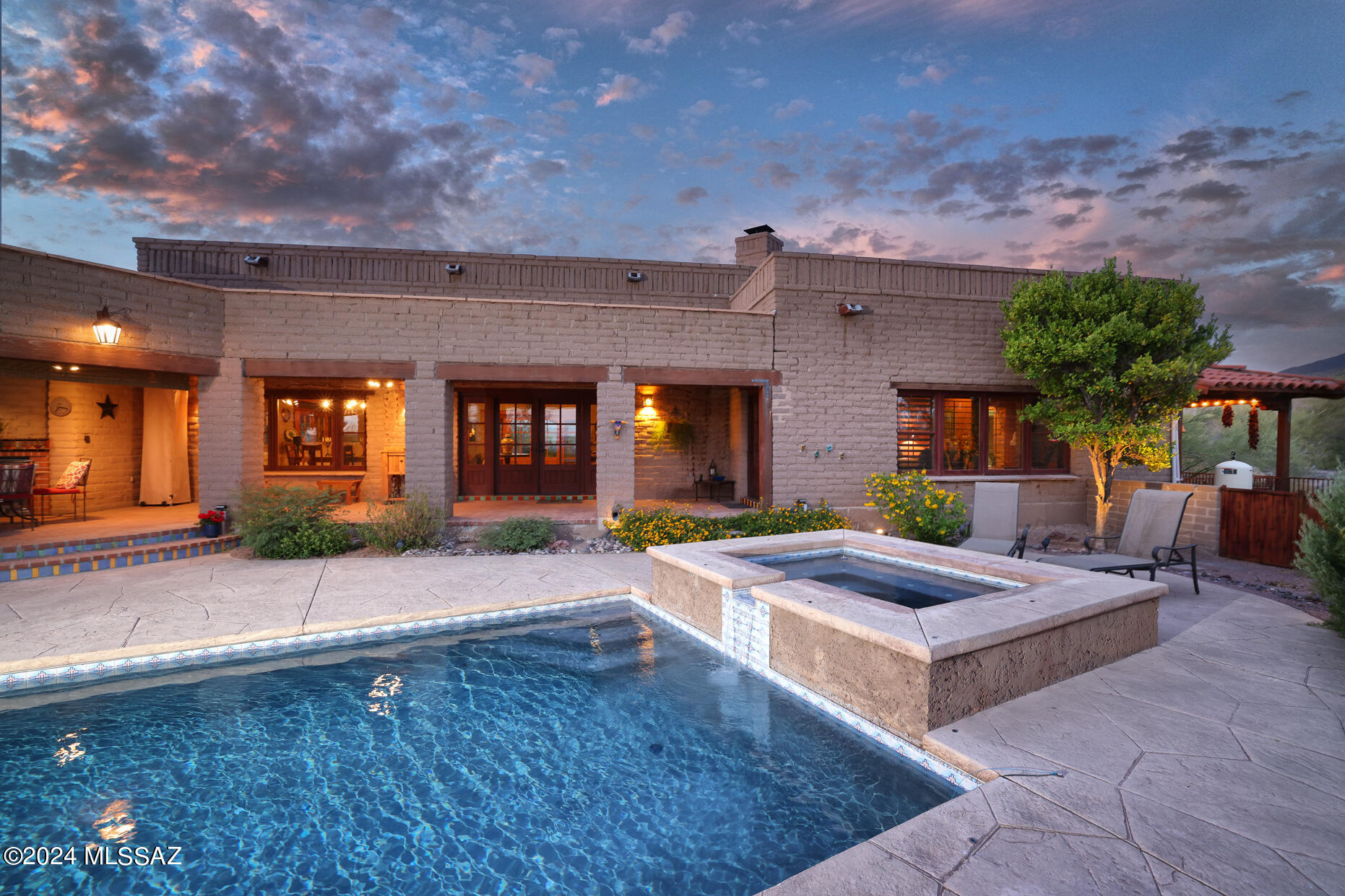 11725 East Spanish Ridge Place Tucson, AZ 85730 - Photo 2 of 51 a front view of house with yard and outdoor seating