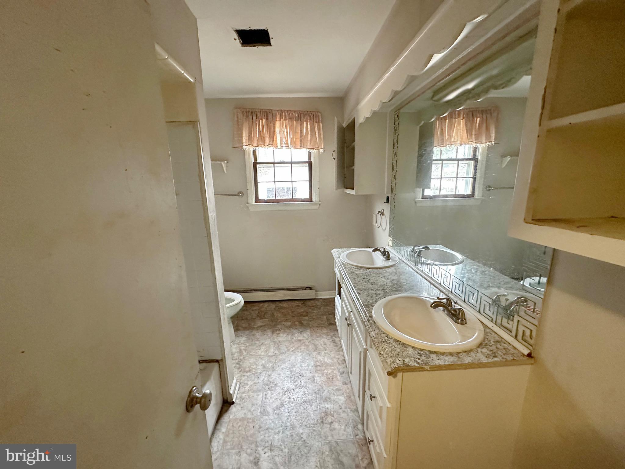 220 Myrtle Avenue Lindenwold, NJ 08021 - Photo 11 of 11 a bathroom with a sink toilet and window