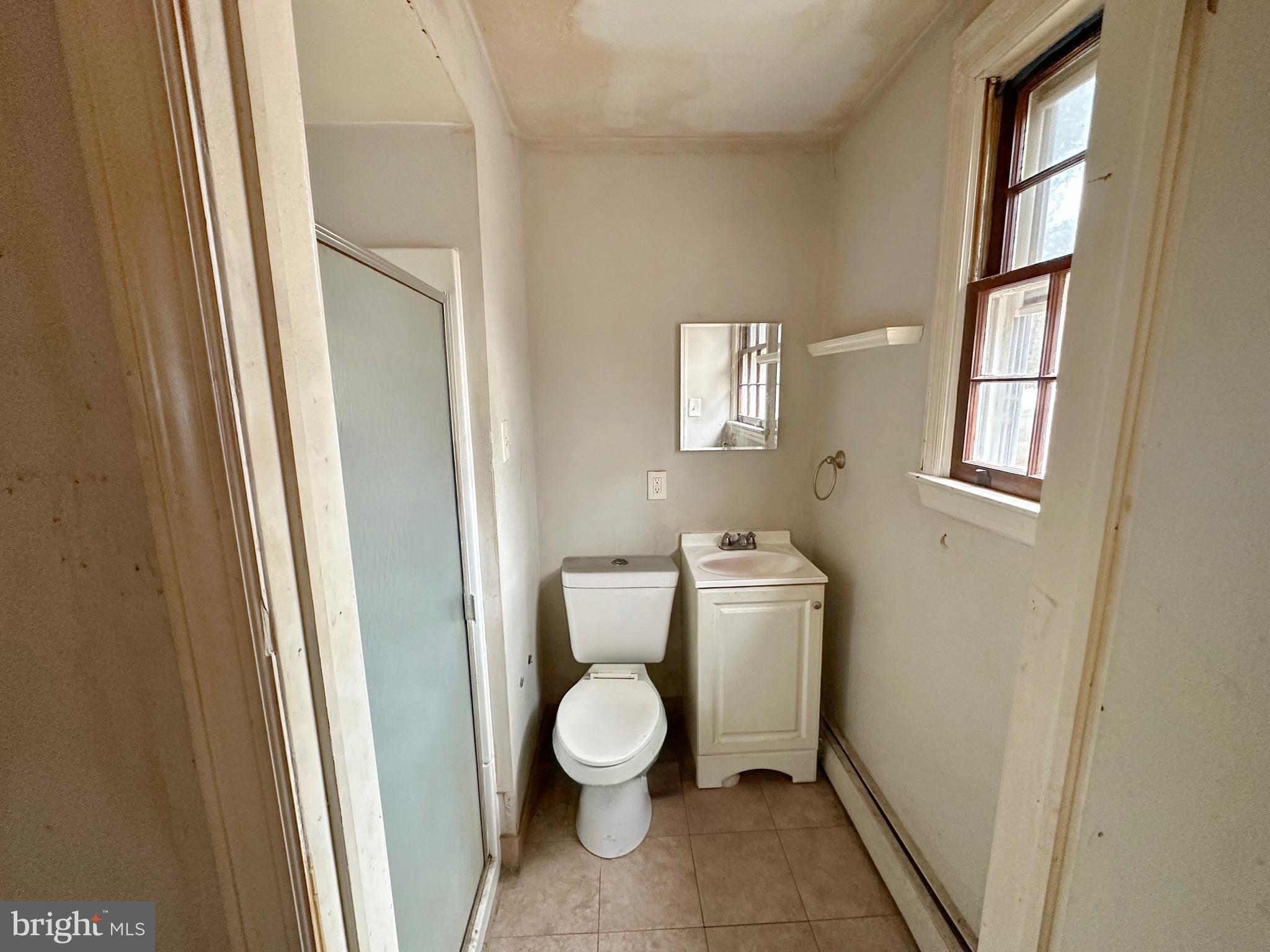220 Myrtle Avenue Lindenwold, NJ 08021 - Photo 7 of 11 a bathroom with a toilet and a shower