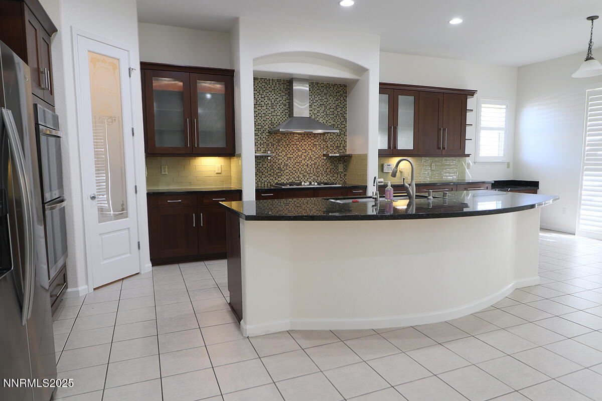 1692 Broadstone Way Reno, NV 89521 - Photo 13 of 31 a kitchen with a sink and cabinets