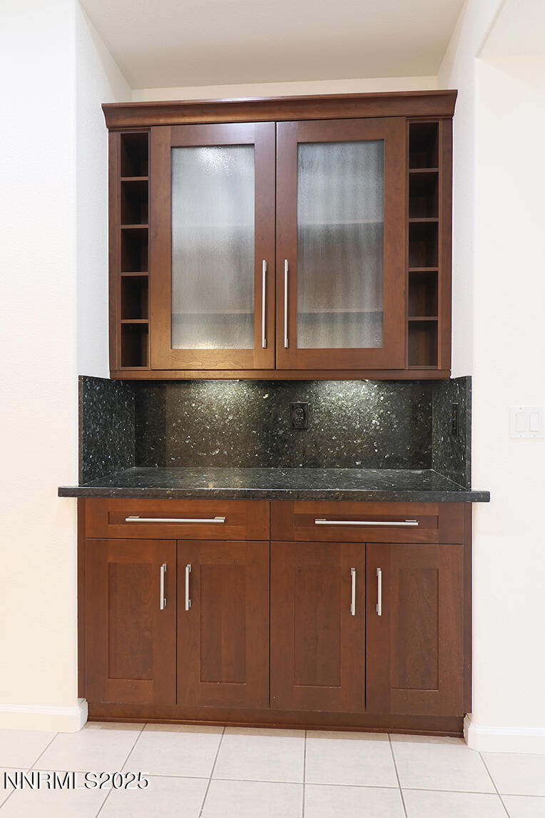 1692 Broadstone Way Reno, NV 89521 - Photo 16 of 31 a kitchen with granite countertop cabinets and window