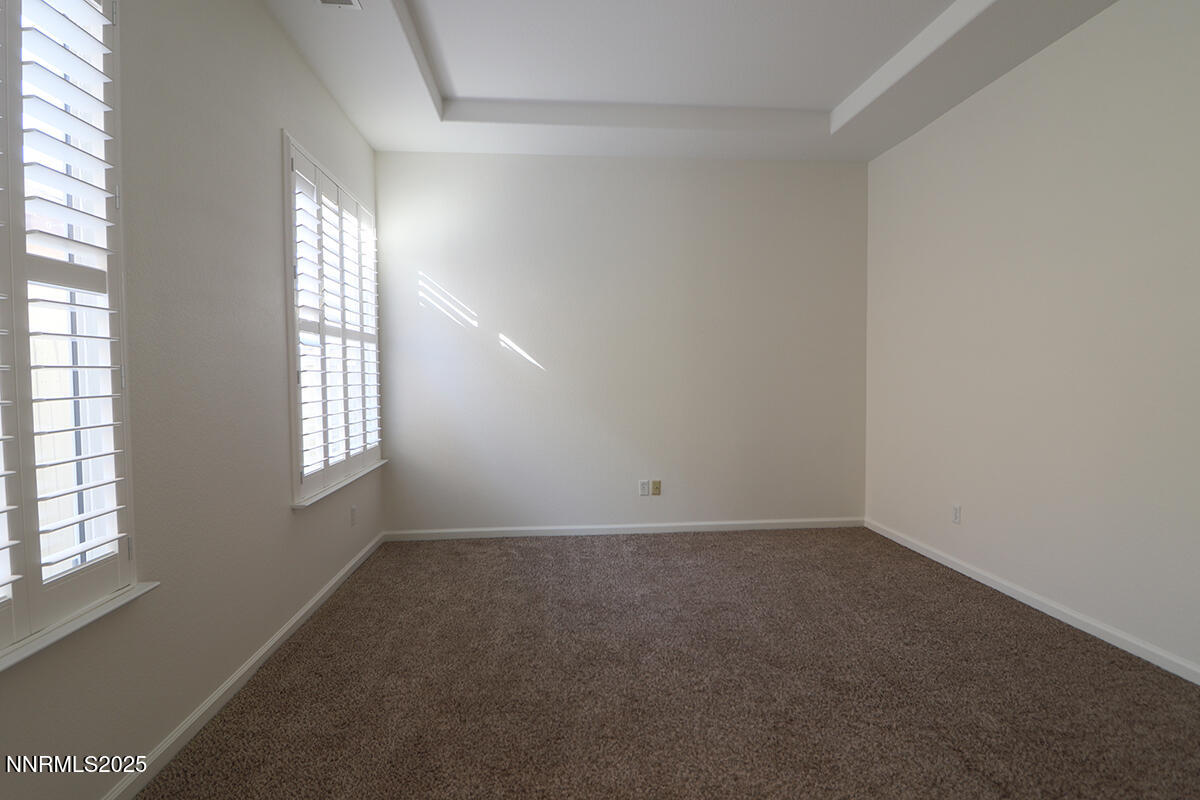 1692 Broadstone Way Reno, NV 89521 - Photo 19 of 31 an empty room with windows and closet