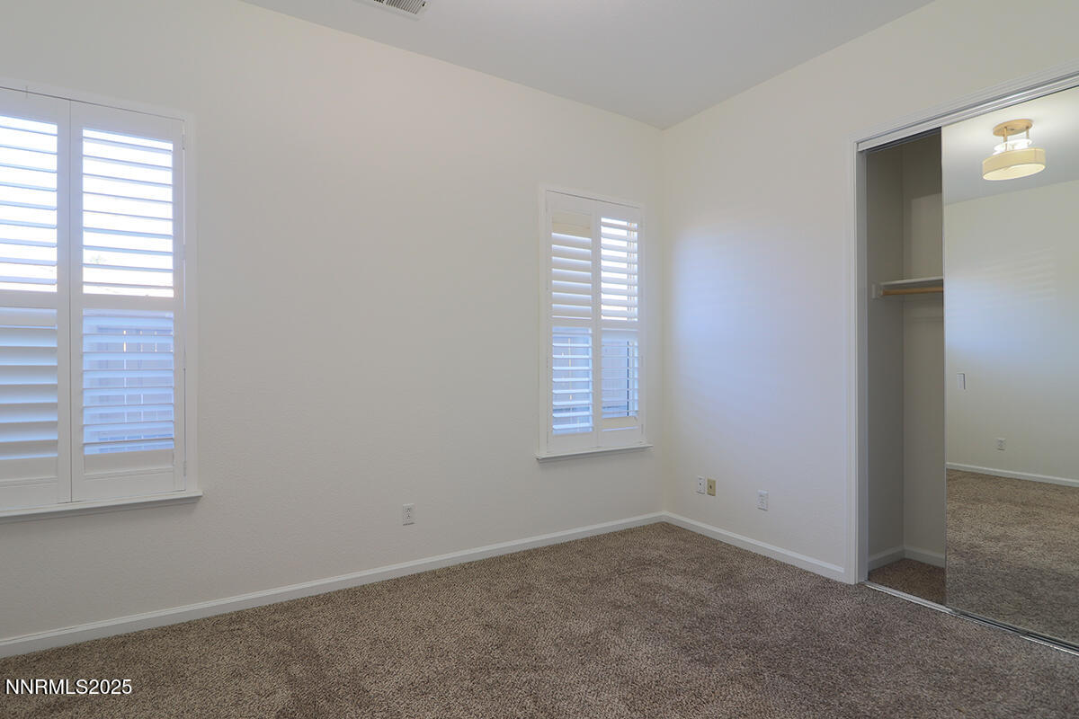 1692 Broadstone Way Reno, NV 89521 - Photo 22 of 31 an empty room with windows