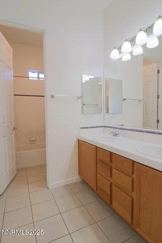 a bathroom with a sink a vanity and a mirror
