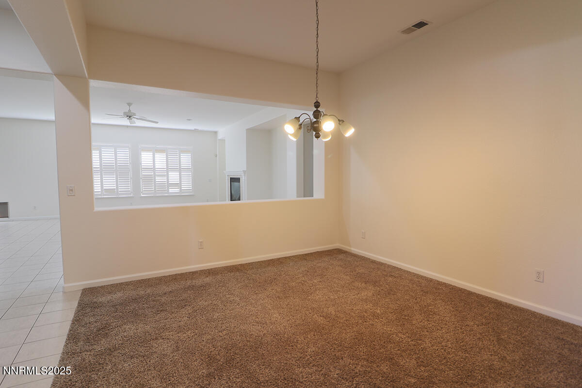 1692 Broadstone Way Reno, NV 89521 - Photo 8 of 31 an empty room with chandelier fan