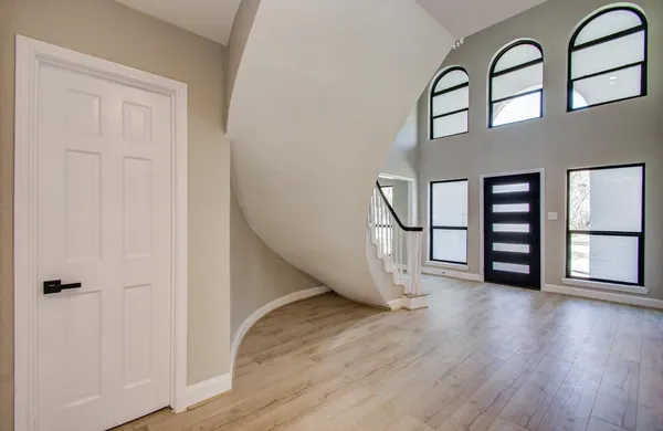 wooden floor in a hall with an entryway