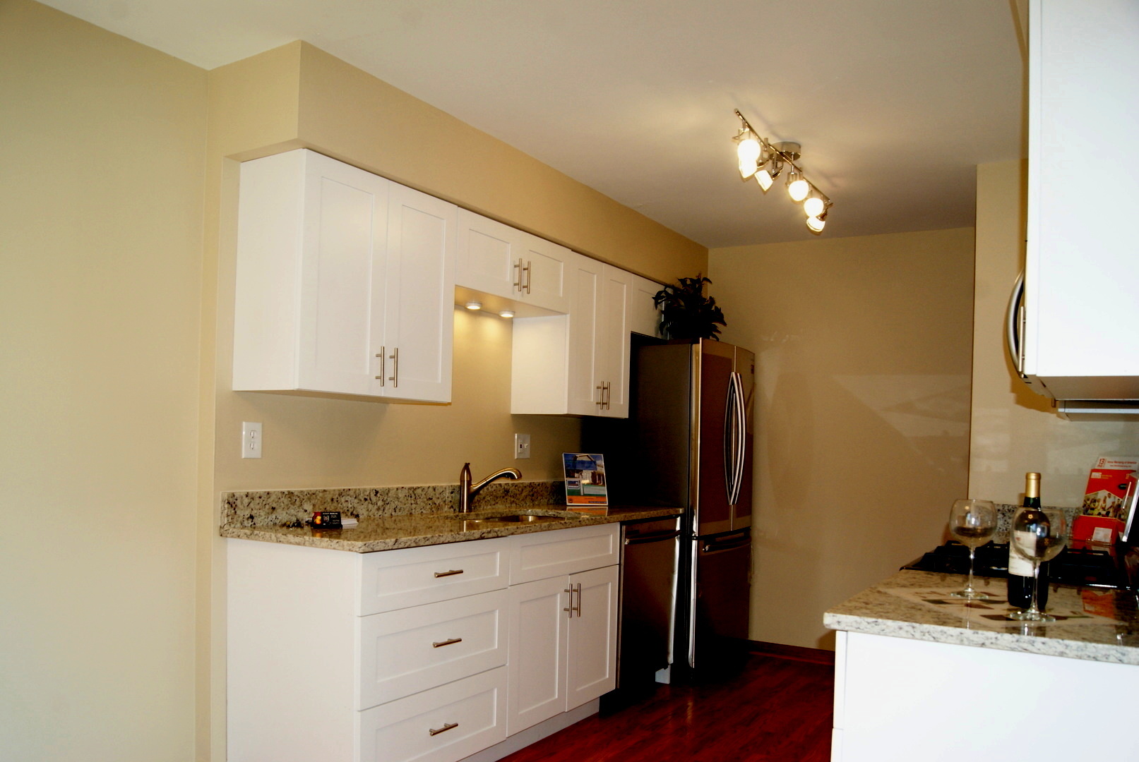 264 Circlegate Road New Lenox, IL 60451 - Photo 2 of 28 a kitchen with a refrigerator sink and cabinets